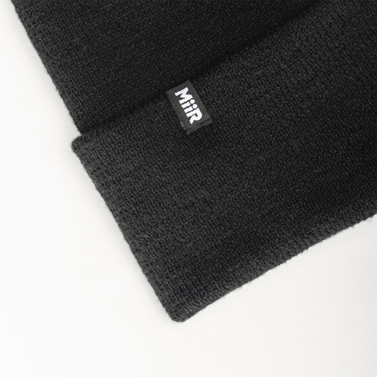 recycled-poly-fine-knit-beanie-v0 WebPDP-RecycledPolyFineKnitBeanie_Studio_TagDetail_Black__BNE005002OS.jpg