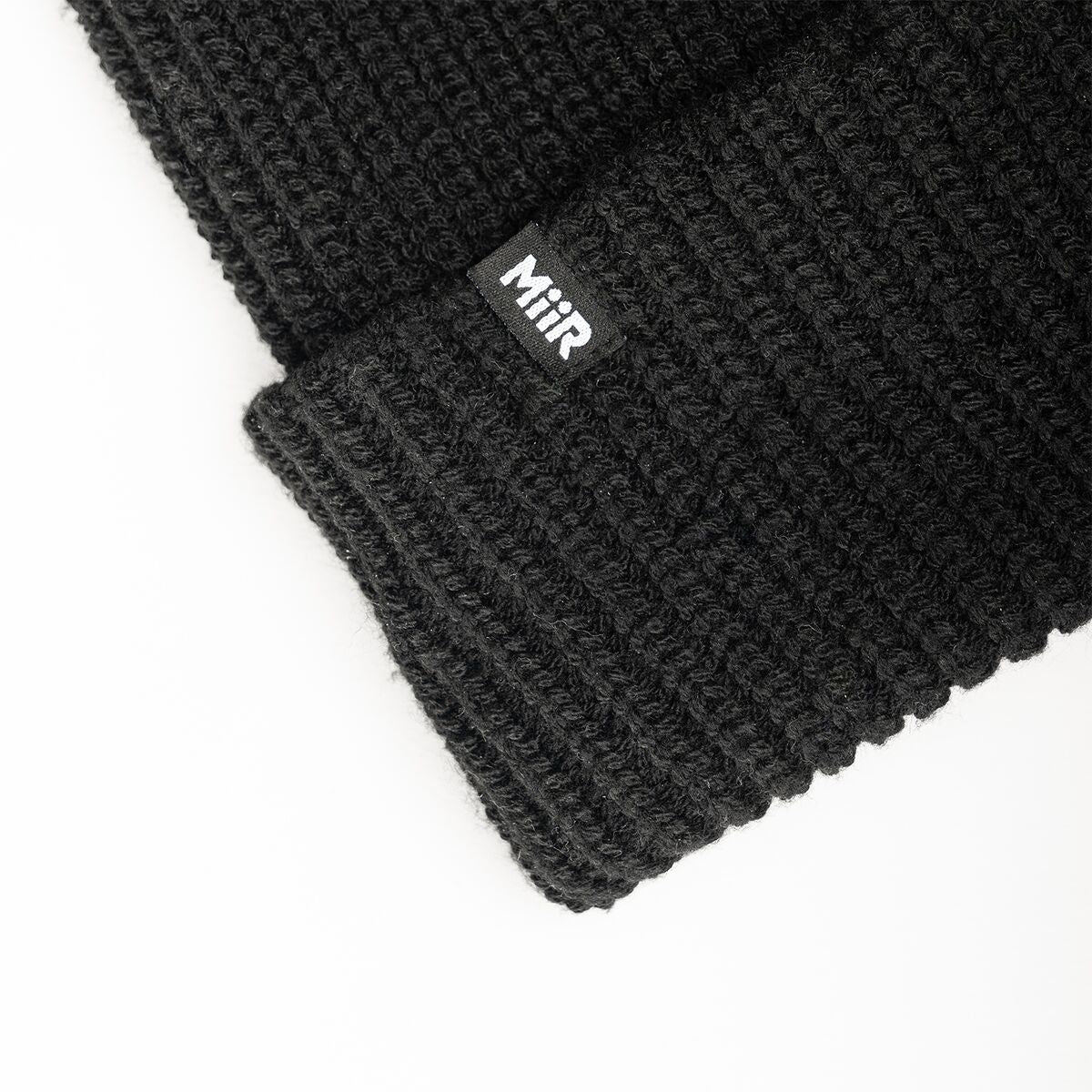 recycled-poly-rib-beanie-i0 WebPDP-RecycledPolyRibBeanie_Studio_TagDetail_Black__BNE002002OS.jpg